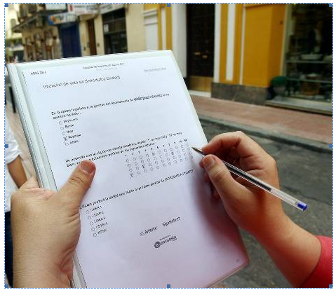 <em>Fig 1.1 A respondent filling a questionnaire</em>
